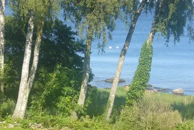 Image de Maison de vacances avec une vue magnifique sur la mer et un grand jardin, WiFi gratuit