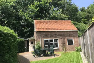 Image de Vacances au pied des dunes dans un appartement d'ambiance avec un grand jardin