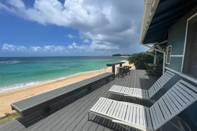 Image de Sunset Beach - Façade blanche et spectaculaire sur la plage de sable blanc