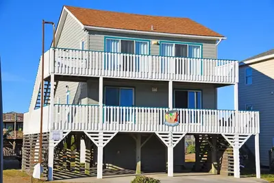 Image de 420 - Maison de location bien entretenue avec un intérieur spacieux et très proche de l'accès à la plage