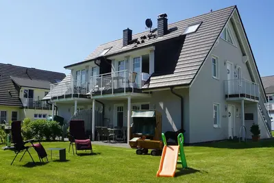 Image de Ren. Appartement au rez-de-chaussée, WiFi, proche de la plage, partiellement clôturé, enfants-u. tierfreundl.