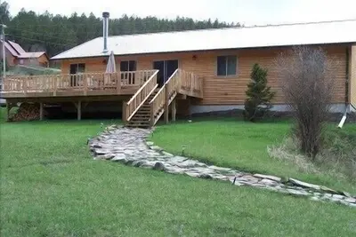 Image de Creekside cabine avec vue sur la montagne