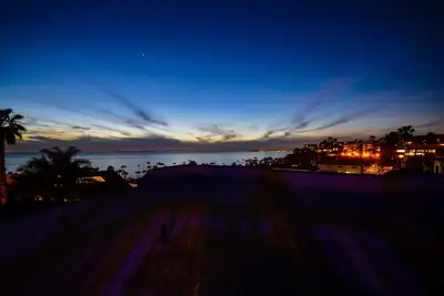 Image de Penthouse, océan scintillant, coucher de soleil, vue sur la ville, climatisation centrale