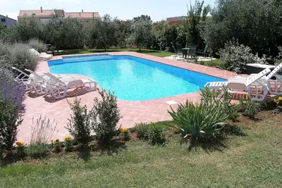 Image de Joli appartement pour 5 personnes avec Wifi, piscine, climatisation, Tv, terrasse et parking