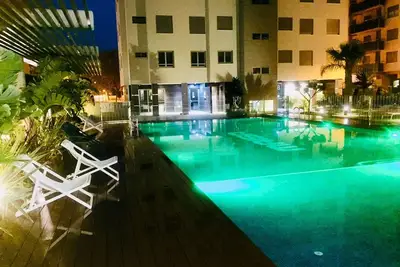 Image de Appartement neuf et confortable à quelques pas de la plage, avec piscine, terrasse et WiFi