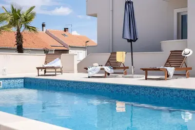 Image de Bel appartement pour 5 personnes avec piscine, Wifi, climatisation, Tv, terrasse et parking