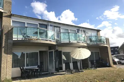 Appartement directement sur la plage des dunes et la mer du Nord, terrasse, WiFi et 2 chambres
