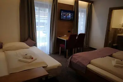 Image de Chambre double confortable avec canapé-lit - Hotel Aschauer Hof