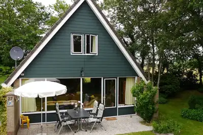 Image de Maison sur un terrain ressemblant à un parc dans le parc de Gudea