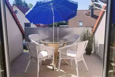 Image de Appartement ensoleillé à 6Pers. avec terrasse sur le toit et espace de stationnement