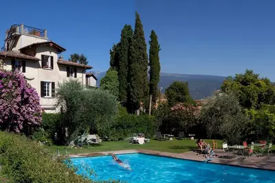 Image de Vg Attico Près du lac avec piscine - 100 m de la piscine de la plage