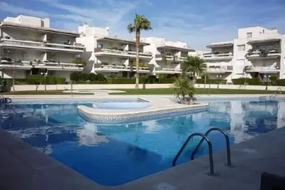 Comfy beach-side apt w\/ beaches, garden terrace, pool, mini golf+parking+wifi