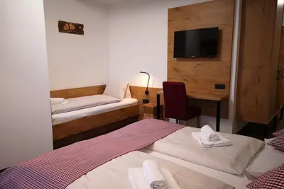 Image de Chambre triple avec douche, Wc - Hotel Aschauer Hof