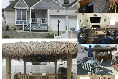 Image de 4 chambres à coucher, 5 min à pied de la plage privée avec son propre bar tiki à l'arrière
