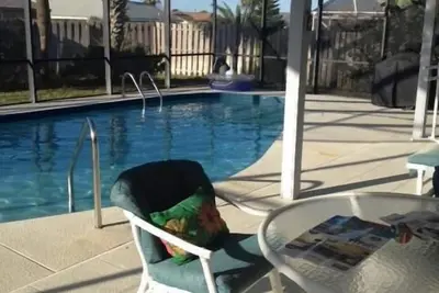 Image de Beach House avec moustiquaire, piscine chauffée et grande terrasse couverte