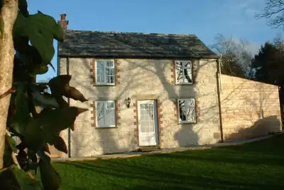 Image de Superbe cottage primé avec bain à remous et sauna à 10 minutes de la plage