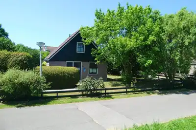 Image de Maison de vacances avec jardin d'hiver dans un parc de vacances calme avec piscine - Hollande du Nord