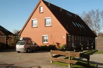 Image de Maison d'angle en rangée, au milieu de Norddeich, endroit calme, familial, WiFi gratuit