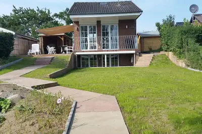 Image de Priwall maison de vacances avec vue sur le lac dans une atmosphère détendue \"Double-Waterfront\"