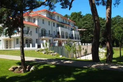 Image de Excl. Appartement-vue directe sur la mer-ambiance cheminée-Wlan, Sauna, Piscine + Tg gratuitement