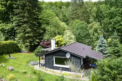 Image de Bungalow en bois dans le parc naturel de Reinhardswald avec 1 000 m² de terrain - près de Kassel