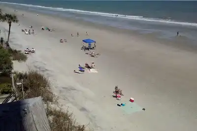 Ocean Front Condo 2-Beach Umbrellas & 5 Chairs Reserved Beach Space for you