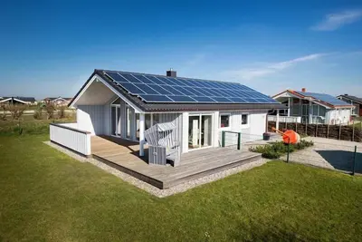 Image de **** spacieux - maison de vacances, Wi-Fi, bain à remous et sauna, situé directement sur la digue