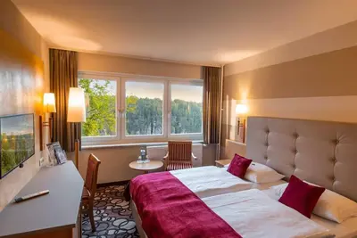 Image de Chambre double, bain, toilette, vue sur le rocher - Berghotel Bastei