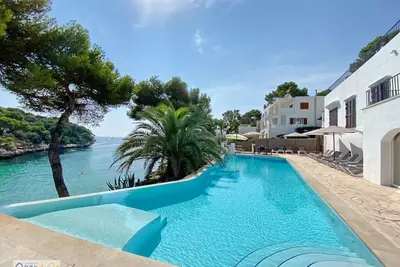 Image de 6 Lits, 6 Bains Première ligne de plage de Cala d´Or avec accès direct emplacement incroyable.