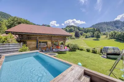 Image de Chalet Xel-Ha**** Vue à 180°, Poêle à bois, Wifi, Sauna, Piscine, Jardin clos.