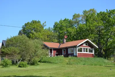 Image de Maison sur le lac avec un bateau, radeau et sauna