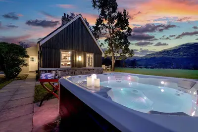 Image de Magnifique chalet converti avec vue imprenable sur le lac et la montagne