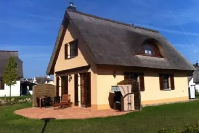 Image de maison de vacances près de la plage avec sauna, 3 chambres, cheminée, lave-linge, WiFi