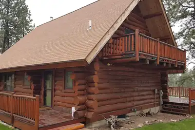 Image de Belle Log Cabin sur Retiré 14 Acres
