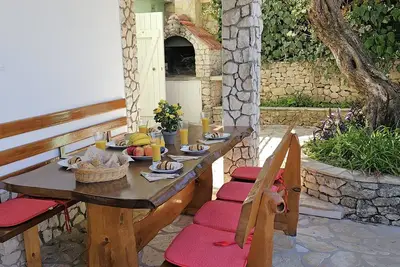 Image de Spacieux rez de chaussée avec jardin, barbecue et accès privé à la plage