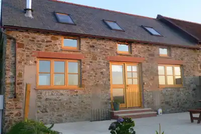 Image de Conversion de grange de luxe au coeur du North Devon dans une petite propriété de 11 acres