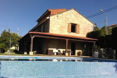 Image de Une Casa da Xeitosa avec piscine privée, WiFi gratuit, barbecue, familles idéales pour PingPong