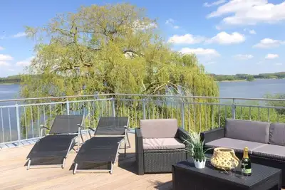 Image de Résidence sur le lac Trammer, belle terrasse sur le toit sur la propriété du lac 🎣🚣
