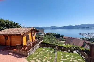 Image de Maison en bois pour 4 personnes avec vue sur la RĂa de Vigo, jardin avec barbecue.