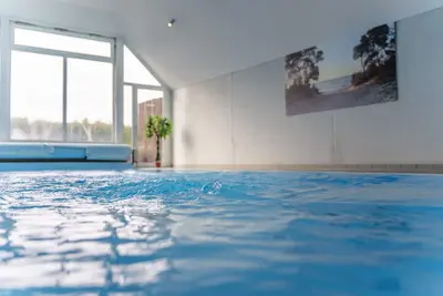 Image de Appartement à Travemünde près, au rez de chaussée avec piscine, sauna, WiFi, grand jardin