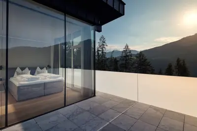 Image de Penthouse alpin avec bain Ă remous et sauna