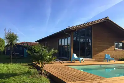 Image de Maison Bois avec piscine chauffée à Seignosse
