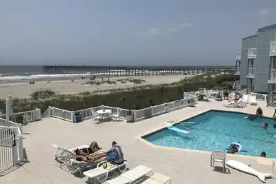 Image de Coquillages dans votre poche - Condo au bord de l'océan - Terrasse, piscine, bain à remous
