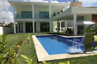 Image de Maison Guarajuba High Standard Cond. Paraíso dos Lagos - Piscine, Wi-fi et Sky