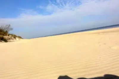 Image de « Maison de pêcheur dans les dunes » sur la mer Baltique en Pologne