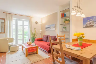 Image de appartement calme près de la plage au rez-de-chaussée avec jardin incl. Piscine intérieure \/ sauna etc.