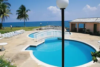 Image de Caché Coral. Sea Palms. Ocean Front Appartement sur la côte nord
