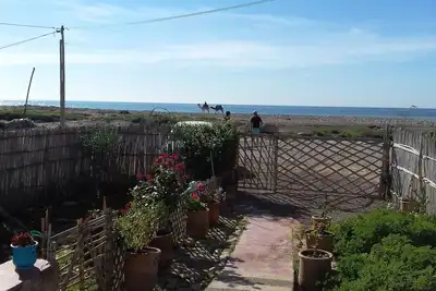 Image de Maison de plain-pied sur La Plage avec Patio et Jardin