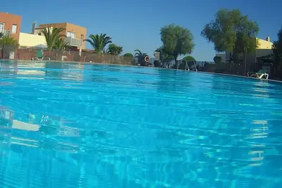 Image de Casazen Maison face piscine avec grand patio et terrasse vue océan