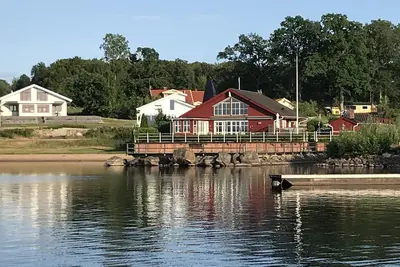 Image de Maison de luxe sur le lac Bolmen, plage de sable avec quai de bateau et piscine chauffée, pêche